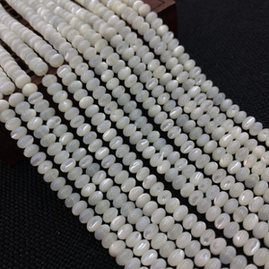 Close-up of natural white shell butterfly beads 8x12mm for DIY jewelry making