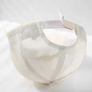 Breathable mesh baby baseball cap in beige with adjustable velcro strap back view