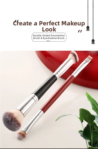 Close-up of double-ended foundation and eye makeup brushes with two-tone synthetic fibers