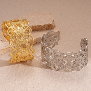 18k gold plated hollow flower open bangles with zircon accents on a natural stone base