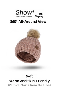 Detail of winter knit hat featuring a faux fur pompom and cozy fleece lining interior