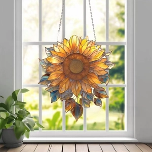 Detail of vibrant acrylic sunflower window hanging with golden petals and metal chain