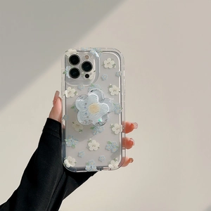 Detail of floral iPhone case with blue and white flowers and a glitter liquid flower stand