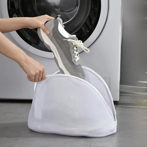 Mesh laundry bag for sneakers being used in a front-load washing machine setup