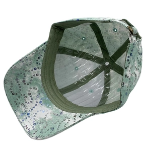 Detailed interior of sequined baseball cap showing sweatband and adjustable metal buckle