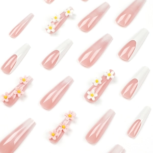 French tip press-on nails with 3D floral accents and translucent pink ombré finish