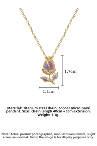 Macro detail of tulip pendant with gradient blue gemstone and crystal leaf accents