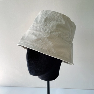 Detailed view of the off-white bucket hat fabric texture and small side logo detail