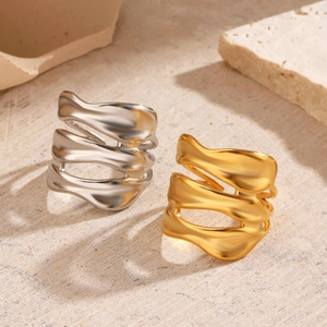 Irregular wavy stackable rings in gold and silver finish with organic minimalist design