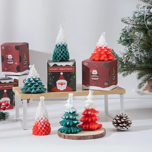 Handcrafted Christmas tree scented candles in red, green, and white for holiday decor