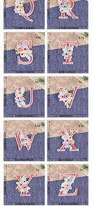 Detailed view of floral letter embroidery patches from Q to Z for clothing decoration
