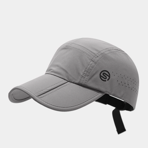 Detail of gray quick-dry hat featuring side ventilation holes and adjustable drawstring