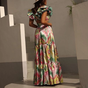 Detail of two-piece floral print set with ruffled crop top and tiered maxi skirt