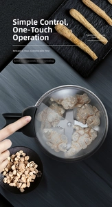 Detailed top view of an electric grain grinder with sharp steel blades and transparent cover