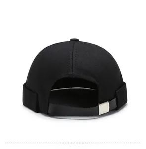 Rear view of black docker hat featuring adjustable leather strap and silver metal buckle
