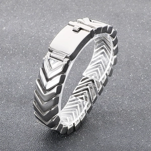 Macro detail of V-shaped interlocking links in a polished silver stainless steel bracelet