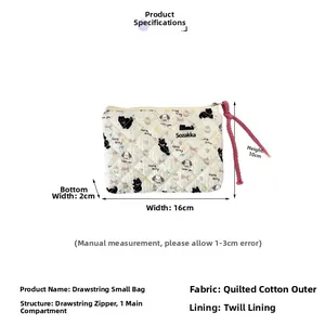 Detailed view of quilted cotton pouch showing 16x10x2cm dimensions and floral pattern