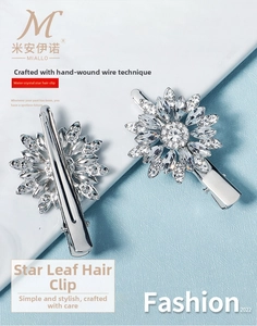 Close-up of sparkling rhinestone flower hair clips with elegant silver metal duckbill grip