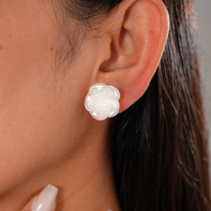 Set of minimalist white resin rose earrings with pearl luster and geometric floral design