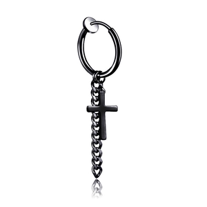 Detail of black clip-on earring featuring a hanging cross pendant and short metal chain