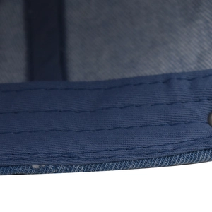 Close-up detail of reinforced parallel stitching on vintage washed denim baseball cap