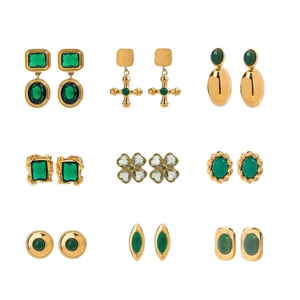 Set of 9 vintage gold stainless steel earrings with green agate gemstones on white background