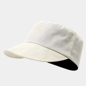 Close-up of the beige linen-cotton blend equestrian hat showing woven texture and material