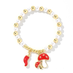 Close-up of beaded bracelet with red chili and mushroom charms on white background
