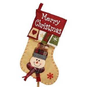 Beige Christmas stocking with snowman appliqué and red cuff featuring Merry Christmas embroidery