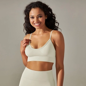 Detailed view of seamless ribbed knit fabric on a vanilla sports bra and shorts set