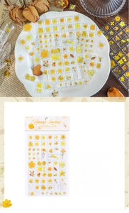 Detail of yellow 3D acrylic dried flower stickers for DIY scrapbooking and crafts