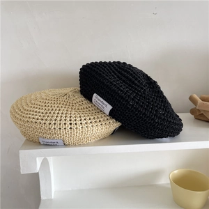 Knitted straw berets in beige and black featuring a breathable hollow weave design
