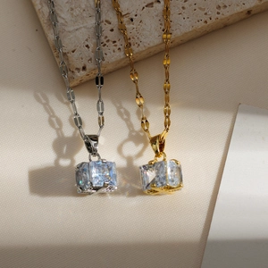 Elegant cherry-inspired square zircon necklaces in gold and silver finishes on stone