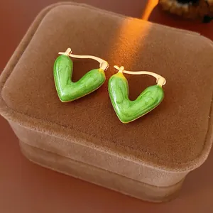 Vintage gold V-shaped enamel hoop earrings with emerald green texture in luxury gift box