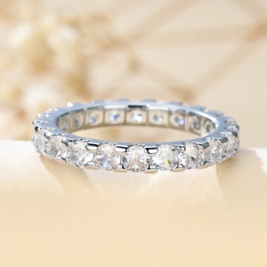 Elegant full eternity silver ring featuring brilliant circular zircon stones and polished metal