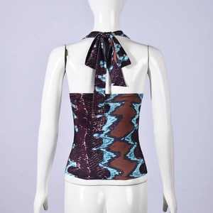Detail of snake print halter top showing open back design and adjustable lace-up ties