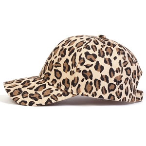 Close-up of leopard print baseball cap showing fabric texture and curved brim detail