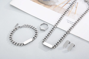 Silver stainless steel jewelry set featuring Cuban chain necklace, bracelet and ring