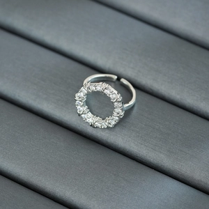 Macro shot of silver ring with pavé-set white cubic zirconia and adjustable band detail