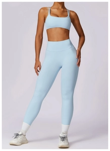 Close-up of light blue high-waisted yoga leggings and matching sports bra set