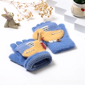 Close-up of blue knitted convertible gloves with yellow cartoon dog patch for kids