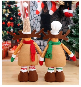 Detailed view of plush Christmas reindeer dolls with corduroy and felt textures