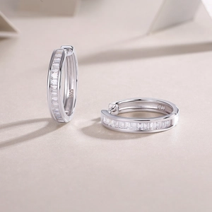 Detailed close-up of double-row moissanite earrings with S925 sterling silver hallmark
