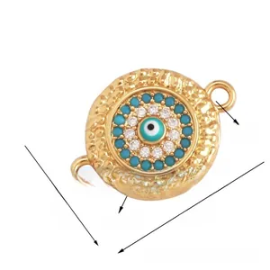 Macro shot of 17mm gold Evil Eye jewelry connector with turquoise accents and crystals