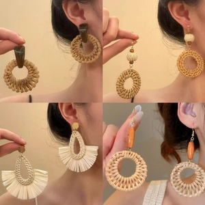 Bohemian style resin and woven rattan earrings with wood beads for beach vacations