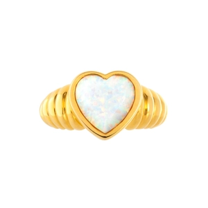 Gold ribbed ring featuring a heart-shaped opal stone centerpiece on a white background