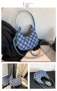 Detail of light blue checkerboard denim crescent bag with frayed edges and silver hardware
