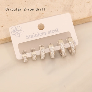 Detailed set of three pairs of stainless steel hoop earrings with double-row crystals