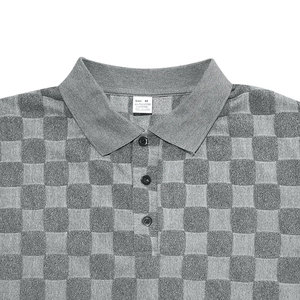 Detail of grey checkered Polo shirt collar with size M and fabric composition labels