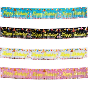 Colorful Happy Birthday tinsel banners in blue, black, white, and pink with gold lettering